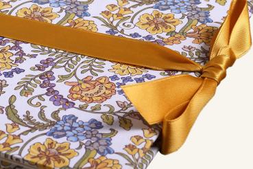 Leporello with yellow and blue floral ornaments, mustard yellow ribbon